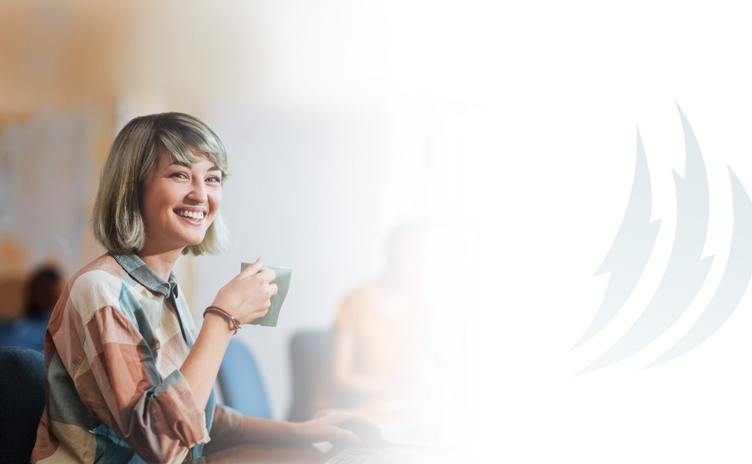 Woman enjoying coffee at her office desk