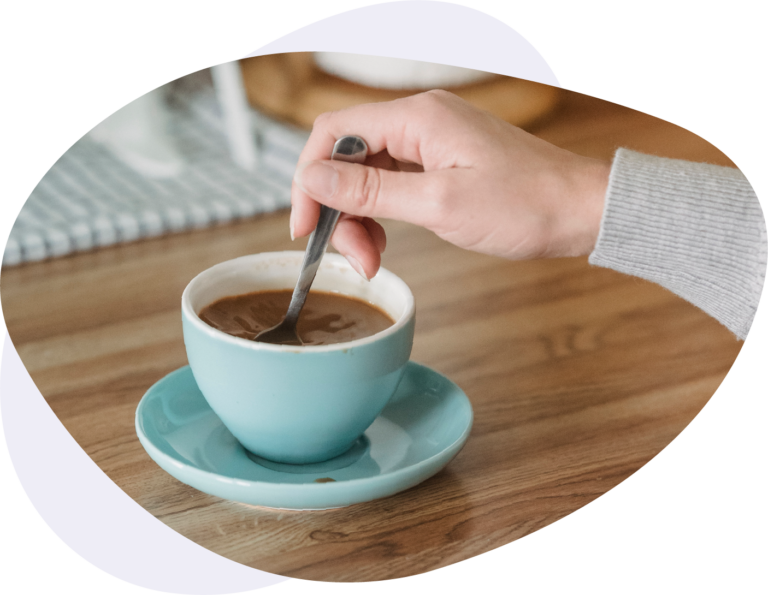Cup of coffee in robin's egg blue colored cup and coaster