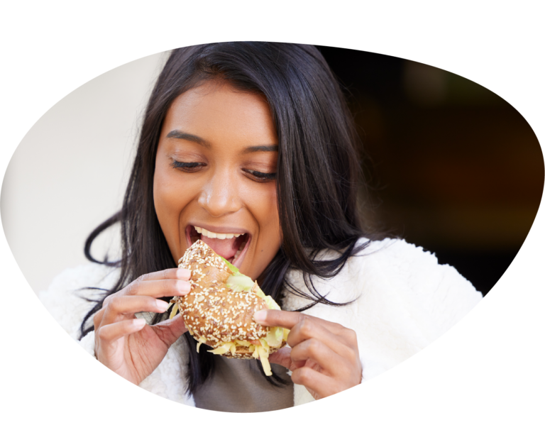 Woman eating a snack in an office setting