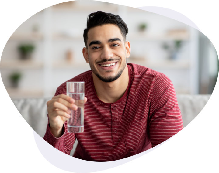 man with glass of water